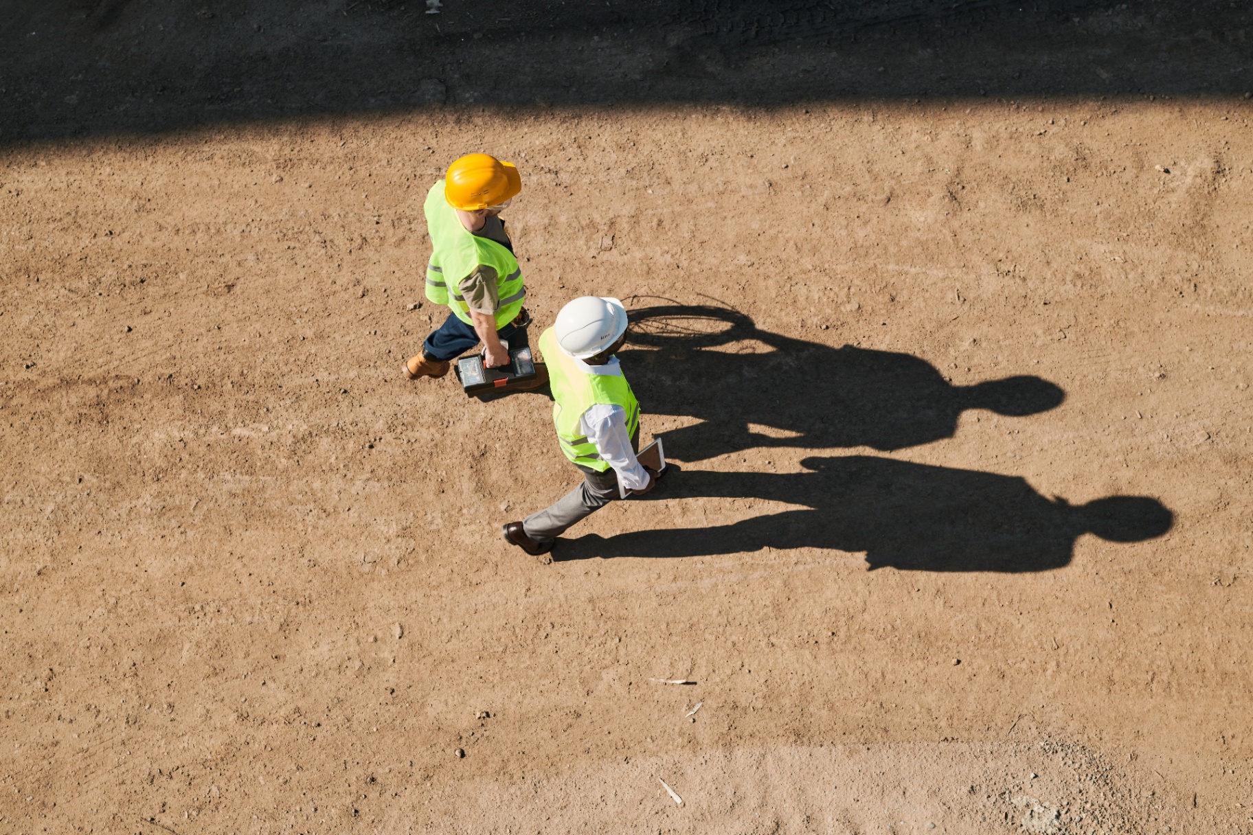 Access Fibre contractors in hi-vis jackets laying fibre cable along a rural UK country lane
